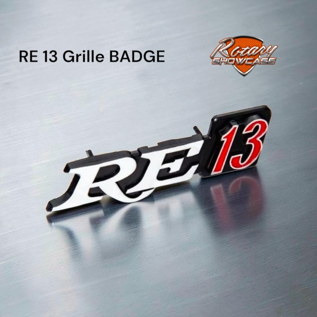 RE 13 grille BADGE